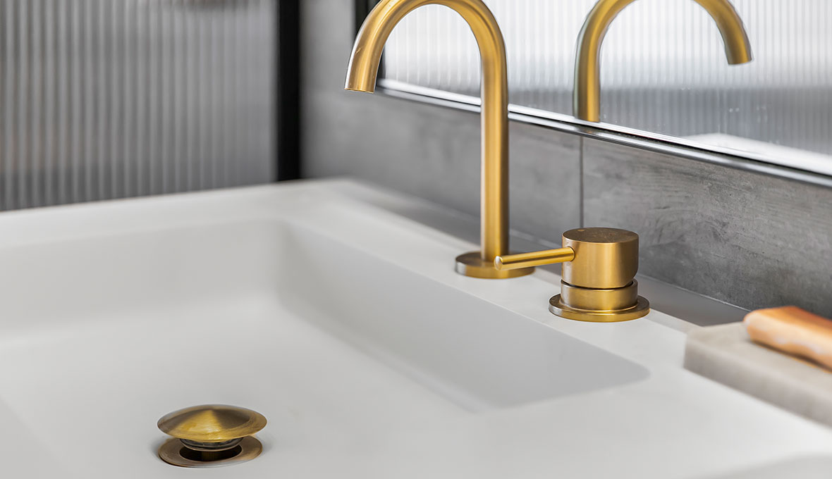 remodelled bathroom with gold tap ware